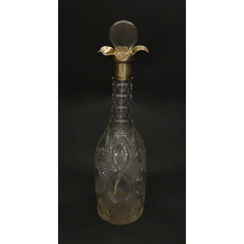 245 - A cut glass decanter of bottle form with silver mount hallmarked Birmingham 1919, maker Mappin & Web... 