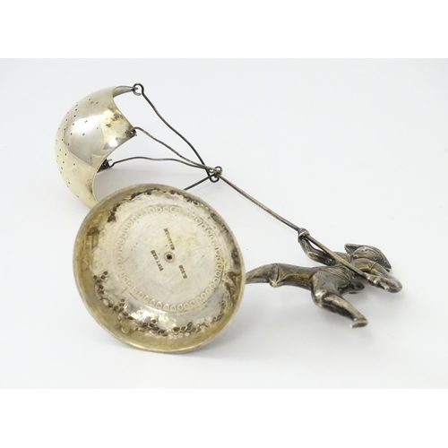 376 - A Vietnamese .900 silver novelty tea strainer formed as a Oriental fisherman the trainer formed as h... 