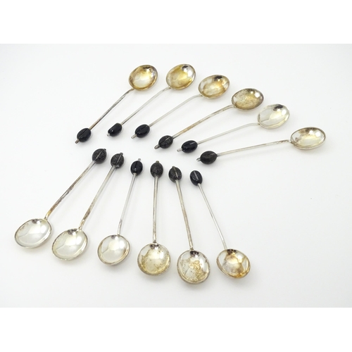 399 - A set of six silver coffee spoons with coffee bean detail to handles, hallmarked Sheffield 1921, Coo... 