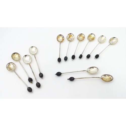 399 - A set of six silver coffee spoons with coffee bean detail to handles, hallmarked Sheffield 1921, Coo... 