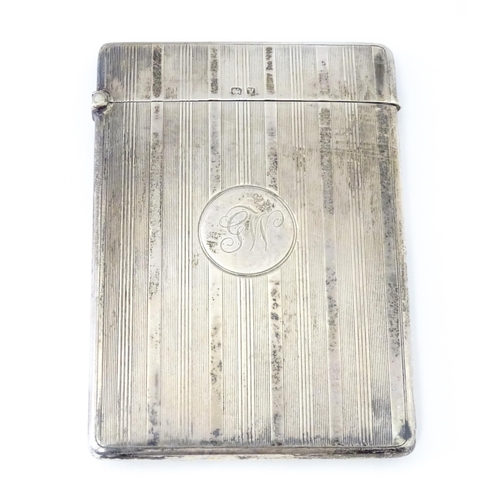 451 - A silver card case with banded engine turned decoration. Hallmarked Birmingham 1920 maker William Ne... 