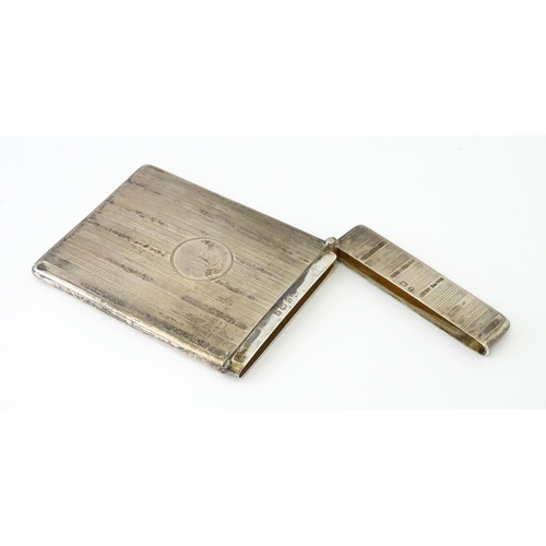 451 - A silver card case with banded engine turned decoration. Hallmarked Birmingham 1920 maker William Ne... 