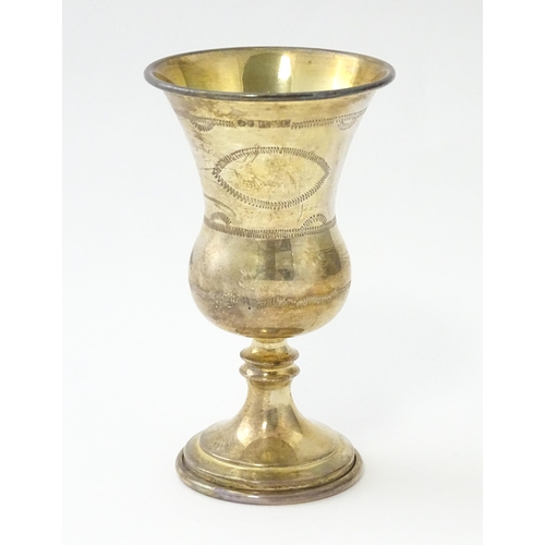 467 - A silver kiddush cup with engraved decoration, hallmarked Birmingham 1966, maker Albert Sydenham. Ap... 