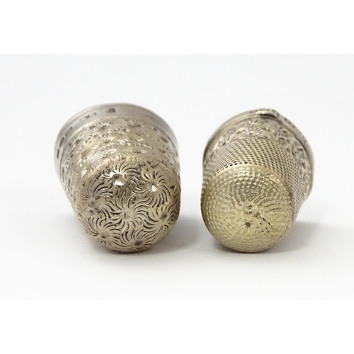 468 - Two silver thimbles with floral decoration, comprising a Victorian example hallmarked Chester 1890, ... 