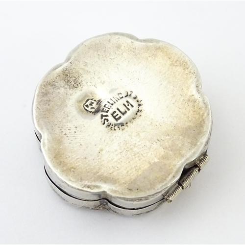 480 - A Mexican silver pill box with inlaid abalone detail. Approx. 1 1/4