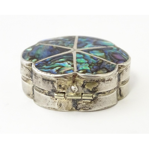 480 - A Mexican silver pill box with inlaid abalone detail. Approx. 1 1/4