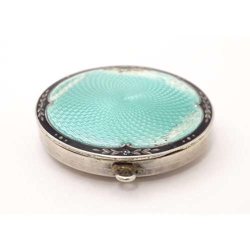 491 - An Art Deco silver compact with guilloche enamel decoration to lid, hallmarked Birmingham 1926, make... 