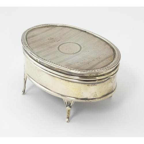 499 - A silver ring box of oval form with engine turned decoration, hallmarked Birmingham 1921, maker E S ... 