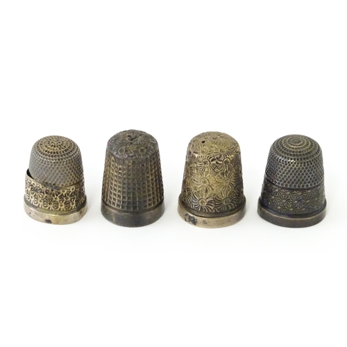 501 - Four assorted silver thimbles to include an example hallmarked Birmingham 1901 maker Henry Griffith ... 