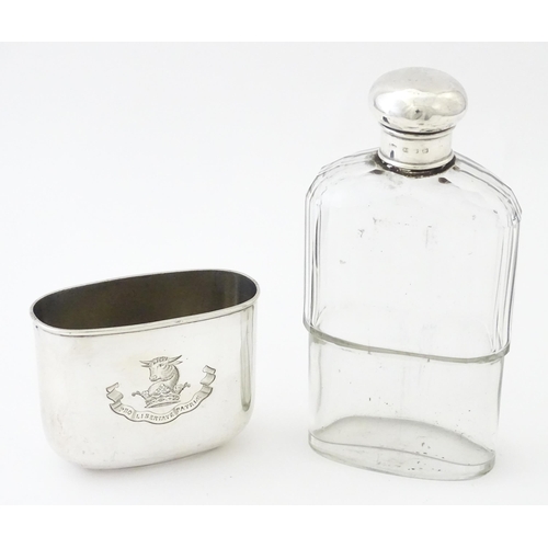 502 - A glass hip flask with silver top, with associated silver beaker lower hallmarked Sheffield 1894, ma... 