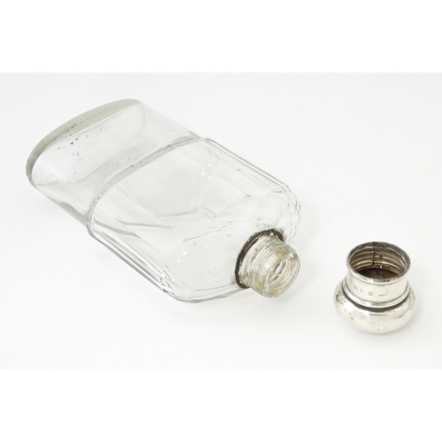 502 - A glass hip flask with silver top, with associated silver beaker lower hallmarked Sheffield 1894, ma... 