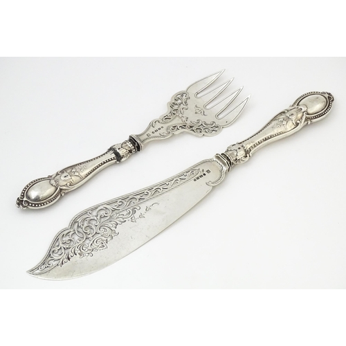 504 - A pair of Victorian silver fish servers hallmarked Birmingham 1865, maker Thomas Prime & Son. Larges... 