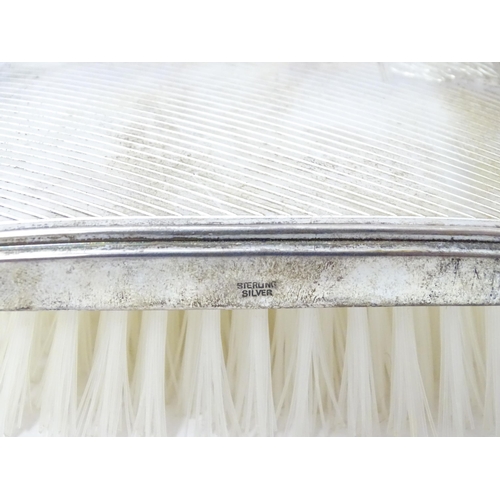 561 - A silver mounted brush with engine turned decoration hallmarked Birmingham 1986, maker Broadway & Co... 