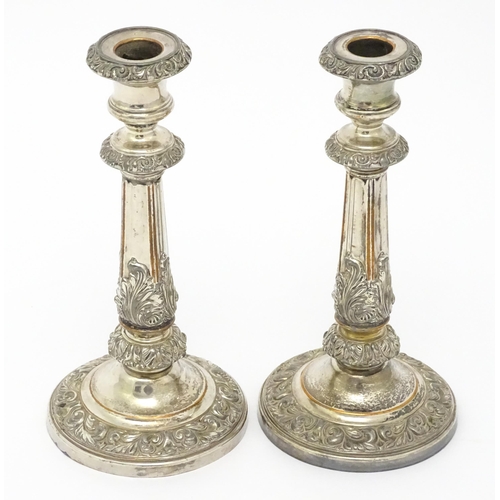 585 - A pair of Sheffield plate candlesticks. Approx. 9