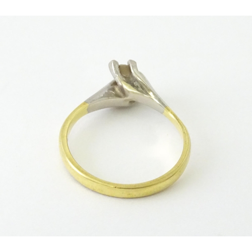 602 - An 18ct gold ring set with two diamonds. Ring size approx. O