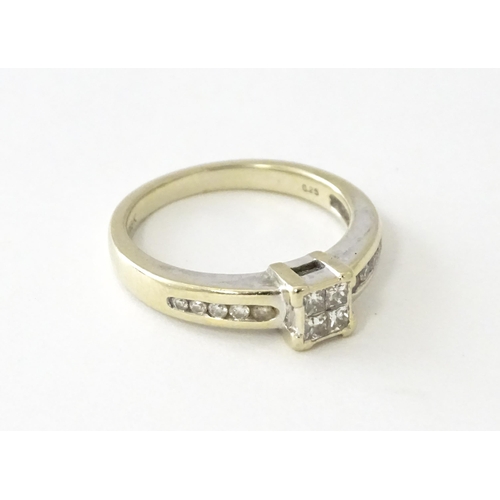 607 - An 18ct white gold ring set with four central diamonds in a square setting, flanked by five channel ... 