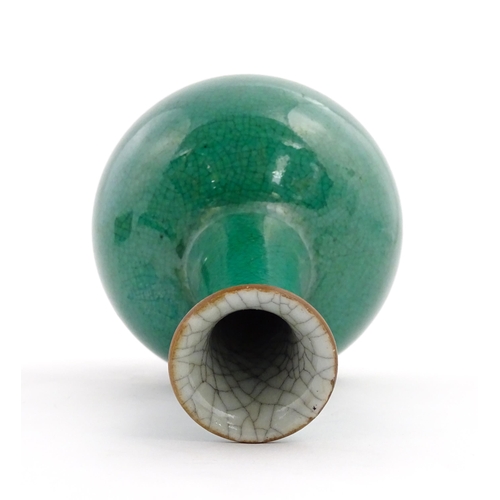 1 - A Chinese bottle vase with green crackle glaze. Approx. 9 1/2