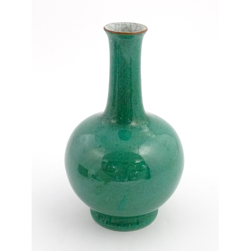 1 - A Chinese bottle vase with green crackle glaze. Approx. 9 1/2