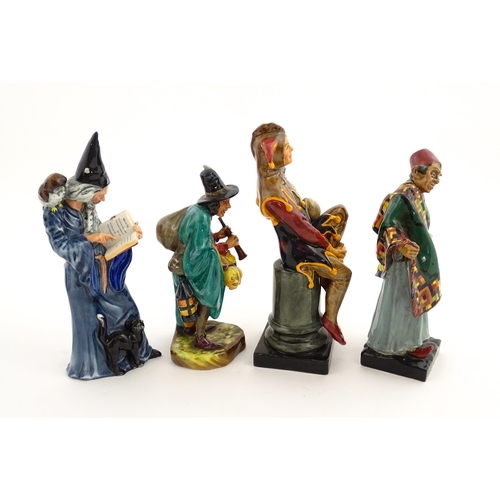 104 - Four Royal Doulton figures comprising The Jester HN2016, The Wizard HN2877, The Mask Seller HN2103, ... 