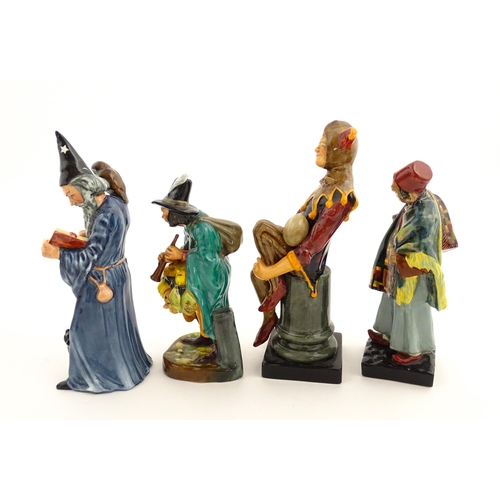 104 - Four Royal Doulton figures comprising The Jester HN2016, The Wizard HN2877, The Mask Seller HN2103, ... 