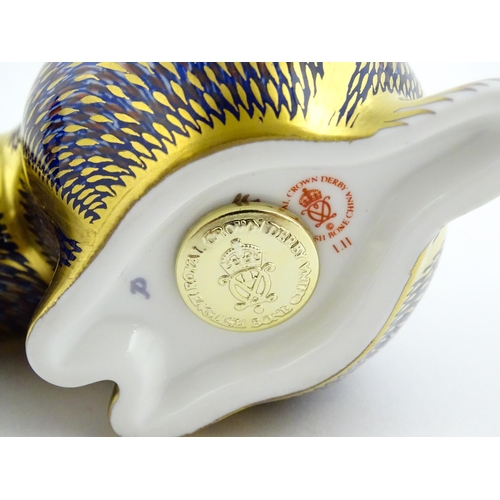 106 - A Royal Crown Derby paperweight modelled as a badger. Marked under. With original box. Badger approx... 