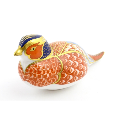 107 - A Royal Crown Derby paperweight modelled as a pheasant. Marked under, with gold stopper. Approx. 6 3... 