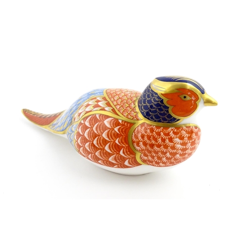 107 - A Royal Crown Derby paperweight modelled as a pheasant. Marked under, with gold stopper. Approx. 6 3... 