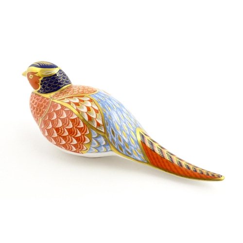 107 - A Royal Crown Derby paperweight modelled as a pheasant. Marked under, with gold stopper. Approx. 6 3... 