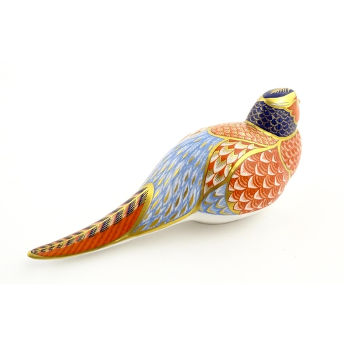 107 - A Royal Crown Derby paperweight modelled as a pheasant. Marked under, with gold stopper. Approx. 6 3... 