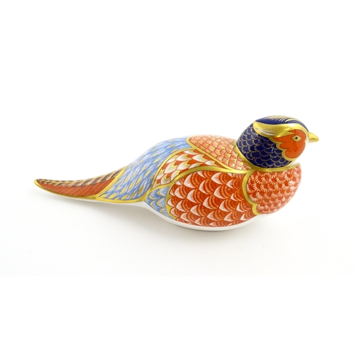 107 - A Royal Crown Derby paperweight modelled as a pheasant. Marked under, with gold stopper. Approx. 6 3... 