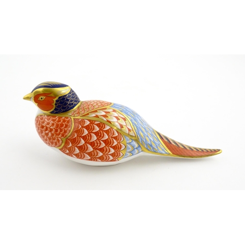 107 - A Royal Crown Derby paperweight modelled as a pheasant. Marked under, with gold stopper. Approx. 6 3... 