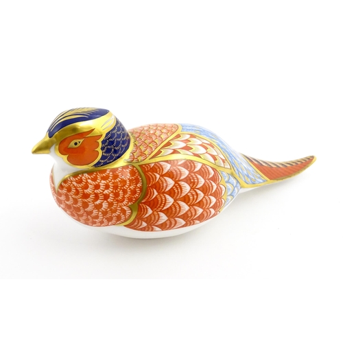 107 - A Royal Crown Derby paperweight modelled as a pheasant. Marked under, with gold stopper. Approx. 6 3... 