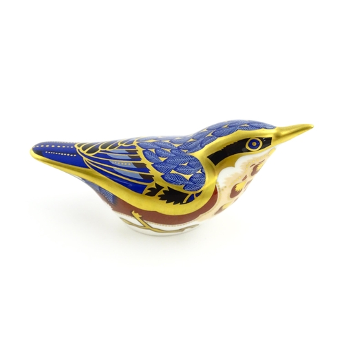 108 - A Royal Crown Derby paperweight modelled as a Nuthatch. Marked under. Approx. 4 1/2