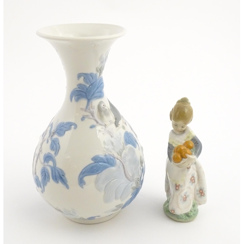 111 - A Lladro vase with flared rim decorated with sparrow birds and flowers, no. 4691.3. Marked under. To... 