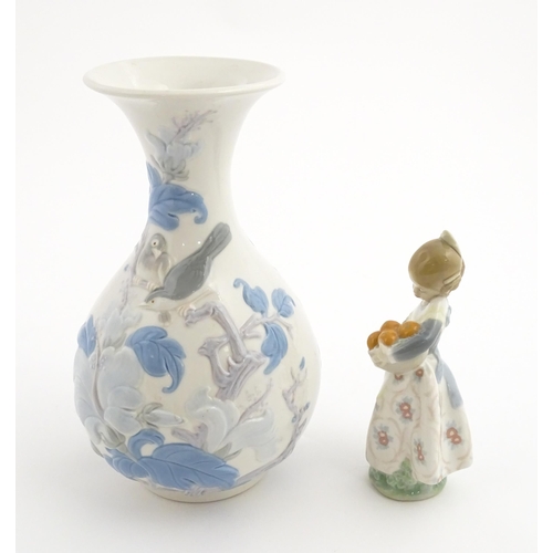 111 - A Lladro vase with flared rim decorated with sparrow birds and flowers, no. 4691.3. Marked under. To... 