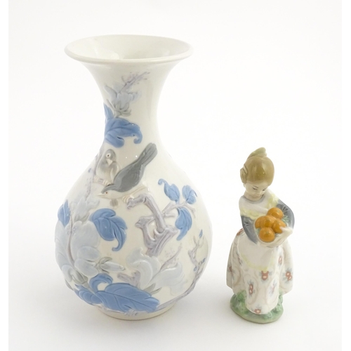 111 - A Lladro vase with flared rim decorated with sparrow birds and flowers, no. 4691.3. Marked under. To... 