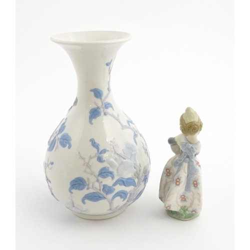 111 - A Lladro vase with flared rim decorated with sparrow birds and flowers, no. 4691.3. Marked under. To... 