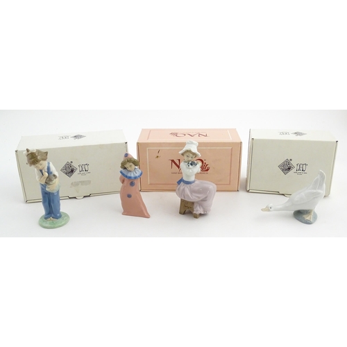 113 - Four Nao figurines comprising Hush Now no. 1069, Timid Pierrot no. 1031, A Big Hug no. 1049, and a d... 