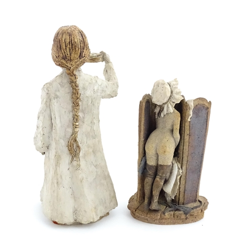 122 - Two studio pottery figurines by Graham Piggott of Blandon Pottery, one modelled as a child in a nigh... 