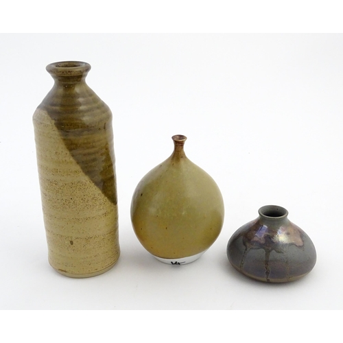 123 - Three studio pottery items comprising a globular vase marked under Moulin Huet Guernsey, a squat vas... 