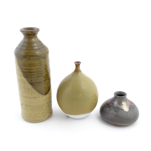 123 - Three studio pottery items comprising a globular vase marked under Moulin Huet Guernsey, a squat vas... 