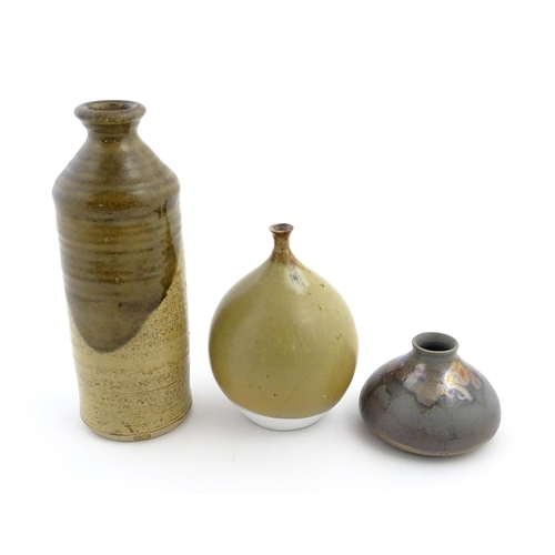 123 - Three studio pottery items comprising a globular vase marked under Moulin Huet Guernsey, a squat vas... 