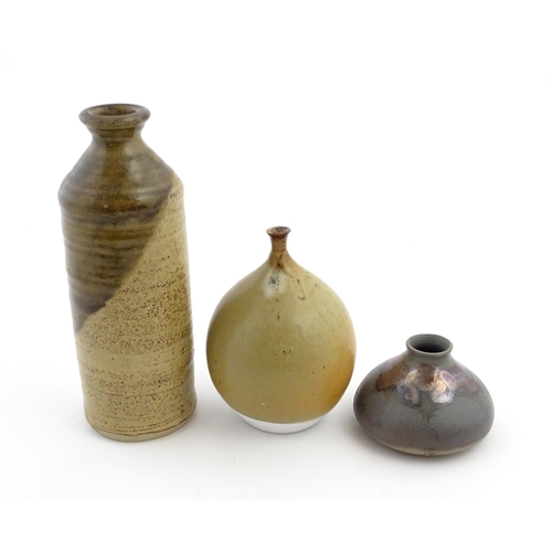 123 - Three studio pottery items comprising a globular vase marked under Moulin Huet Guernsey, a squat vas... 