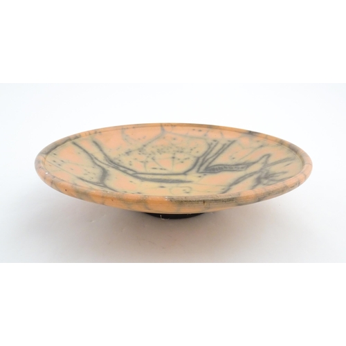 124 - A studio pottery charger with stylised African Eland / Antelope detail. Numbered under 26 03216. App... 