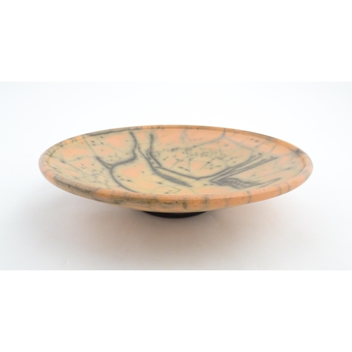 124 - A studio pottery charger with stylised African Eland / Antelope detail. Numbered under 26 03216. App... 