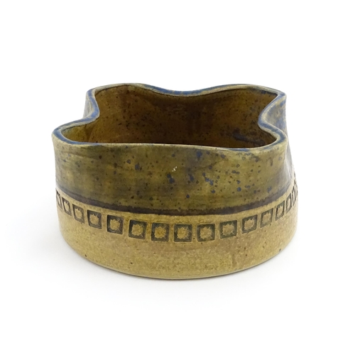 126 - A Swedish Alingas Keramik planter / jardiniere of shaped form with banded decoration. Marked under a... 