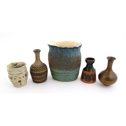 130 - A quantity of assorted studio pottery ceramics to include a candle holder with pierced detail by Cat... 