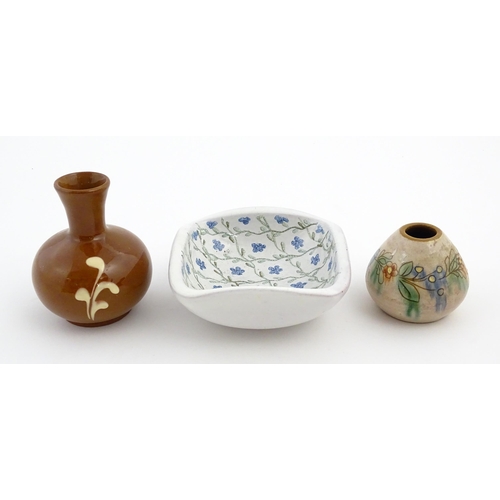 133 - A quantity of assorted ceramics to include three Swedish Nittsjo twin handled pots, a plate with han... 