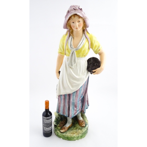 143 - A large Continental model of a milk maid with stool. Impressed under 11058. Approx. 37 1/2