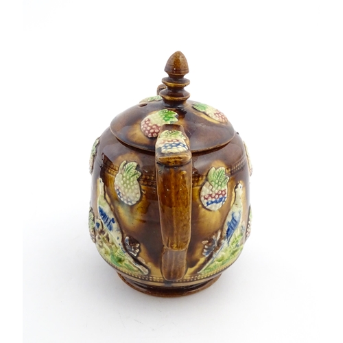 156 - A Victorian Measham bargeware teapot decorated with birds and berries. Approx. 7 3/4